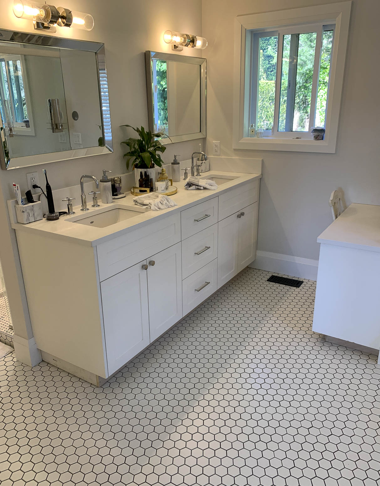 All-white modern bathroom with farmhouse features