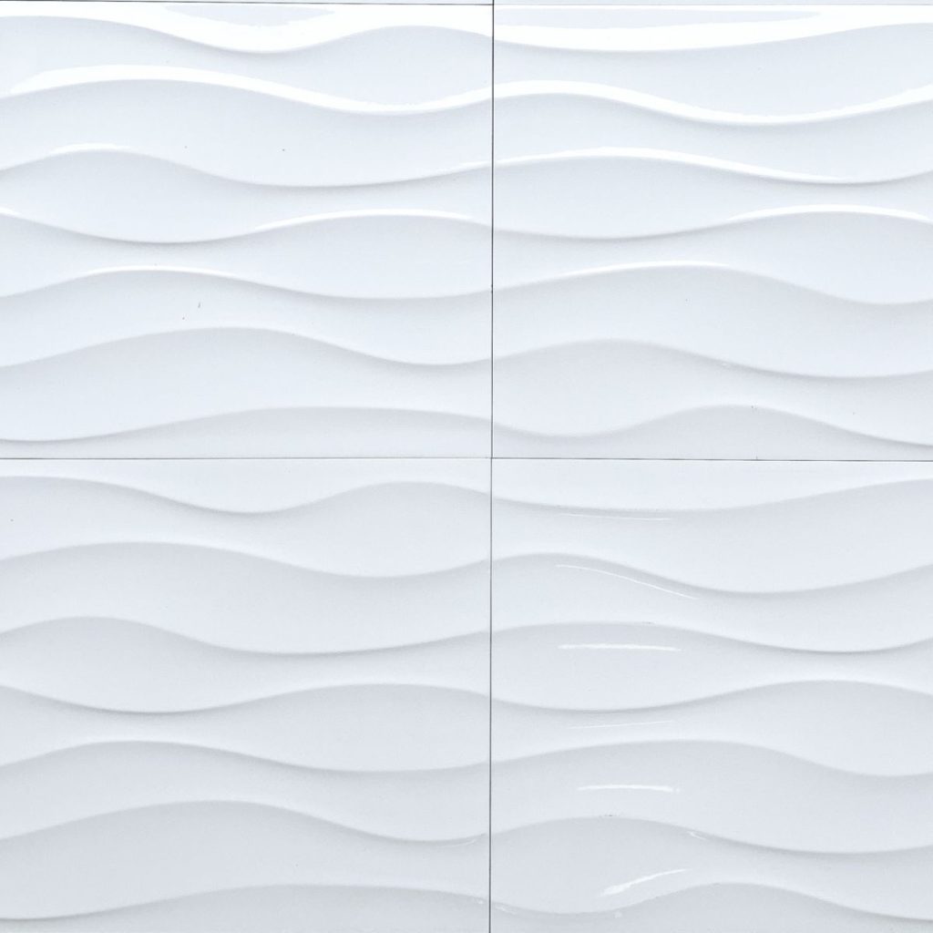 Close-up of Cascade Wavy White textured ceramic wall tile from TileTown.