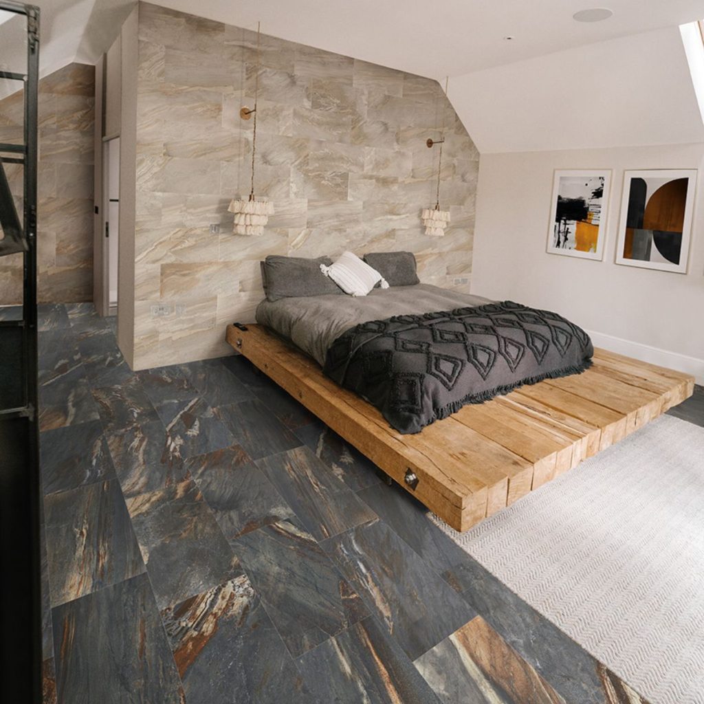 Bedroom with Fitch Rainbow stone-look tile on the feature wall and floor from TileTown.